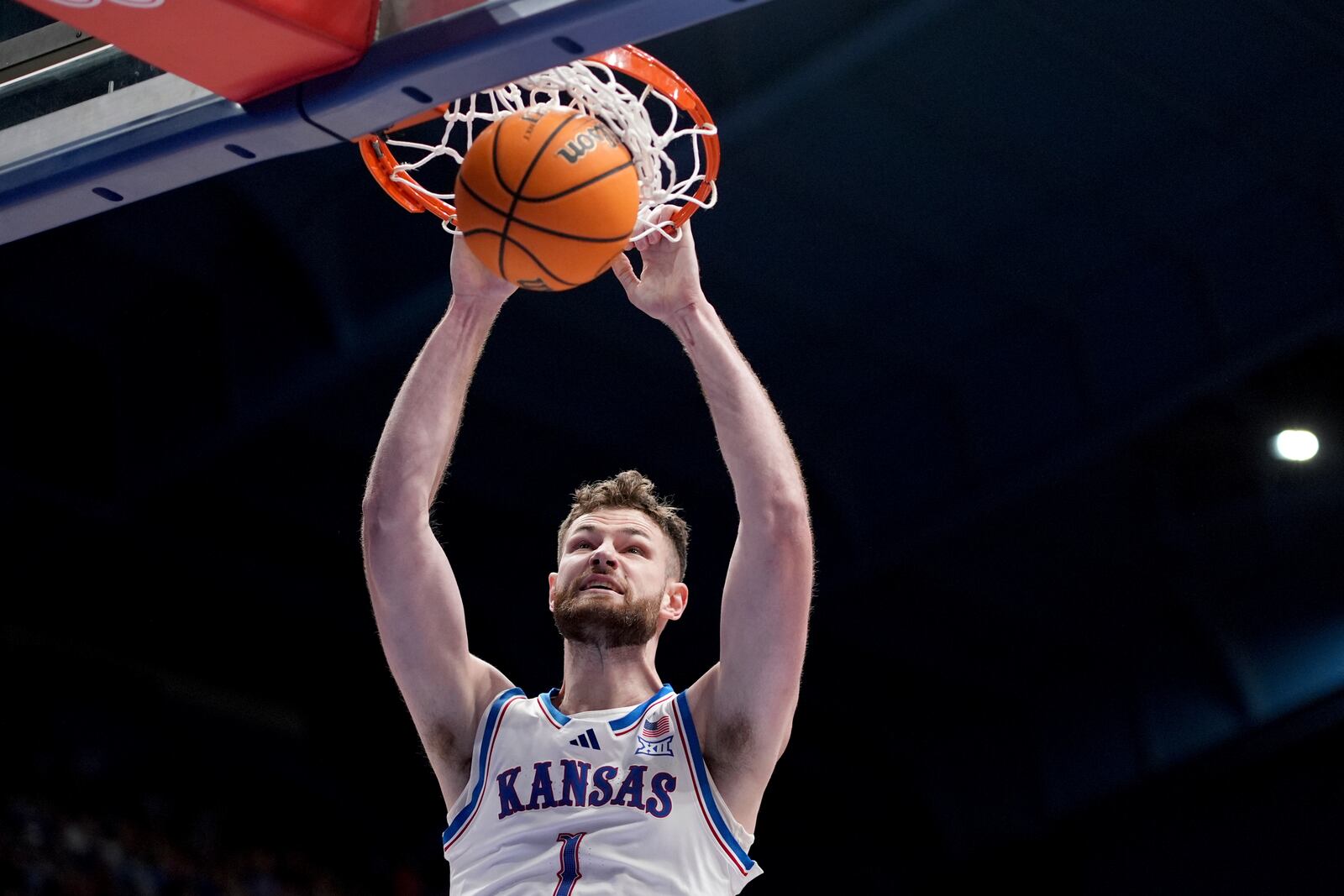 Kansas center Hunter Dickinson dunks the ball during the first half of an NCAA college basketball game against Iowa State, Monday, Feb. 3, 2025, in Lawrence, Kan. (AP Photo/Charlie Riedel)