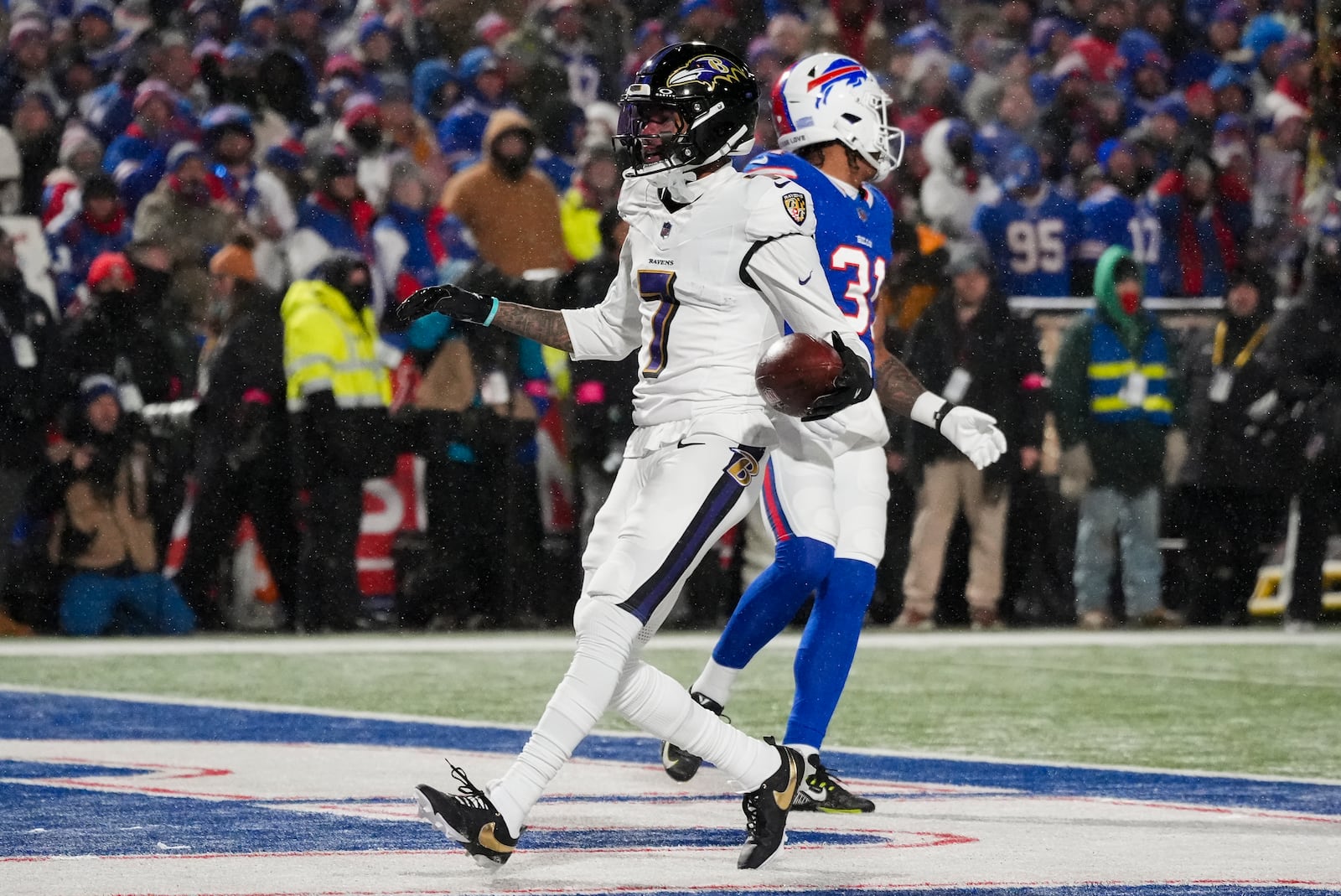 Baltimore Ravens wide receiver Rashod Bateman (7) reacts after making a touchdown catch against the Buffalo Bills during the first quarter of an NFL divisional playoff football game, Sunday, Jan. 19, 2025, in Orchard Park, N.Y. (AP Photo/Gene J. Puskar)