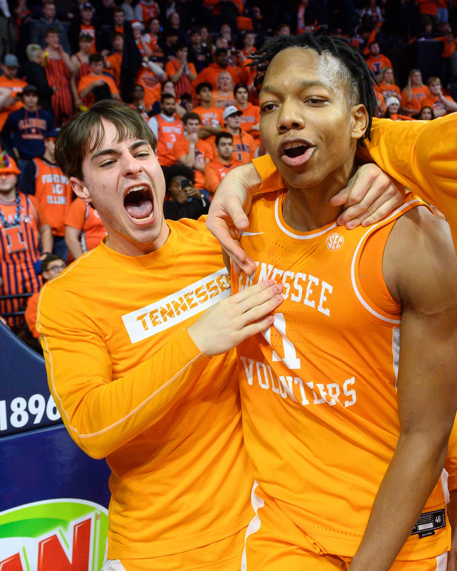 Tennessee's Jordan Gainey, right, celebrates after a win over Illinois in an NCAA college basketball game Saturday, Dec. 14, 2024, in Champaign, Ill. (AP Photo/Craig Pessman)