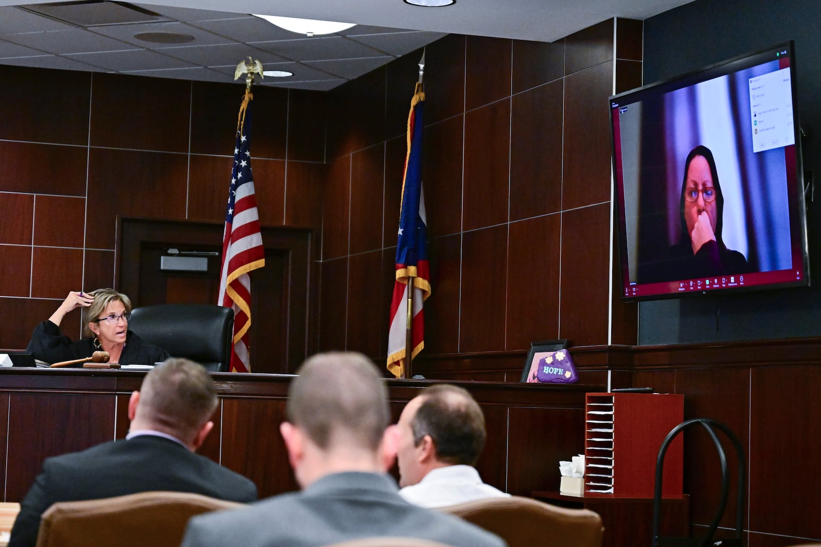 Judge Becky Doherty, left, calls for Nicholas Fontaine, during a hearing at the Portage County Courthouse, Monday, Dec. 2, 2024, in Ravenna, Ohio. Fontaine is charged with one count of illegal voting. (AP Photo/David Dermer)