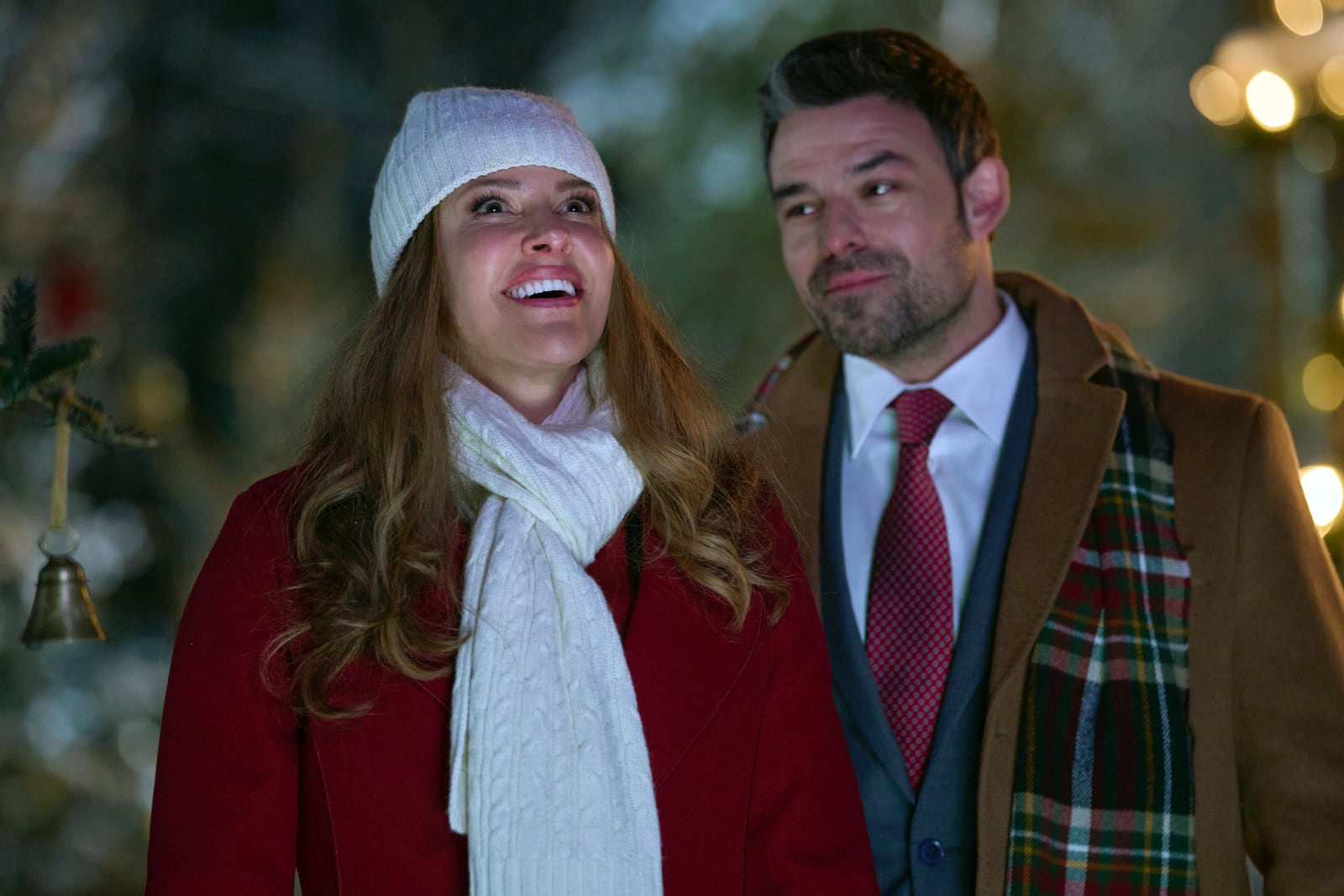 This image released by Great American Family shows Jill Wagner, left, and Jesse Hutch in a scene from "Christmas Under the Northern Lights." (Great American Family via AP)