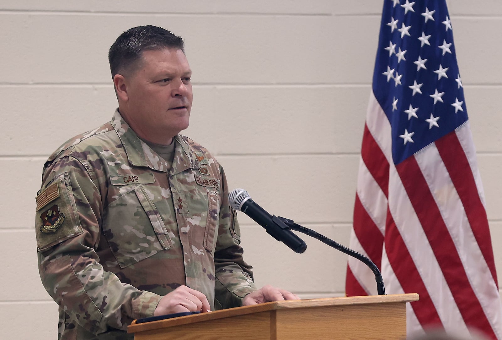 Maj Gen James Camp, Assistant Adjutant General for Air, Oho National Guard, speaks to the Airmen of the 178th Wing of the Ohio Air National Guard during a Call to Duty Ceremony Sunday at the Springfield Air National Guard Base. BILL LACKEY/STAFF