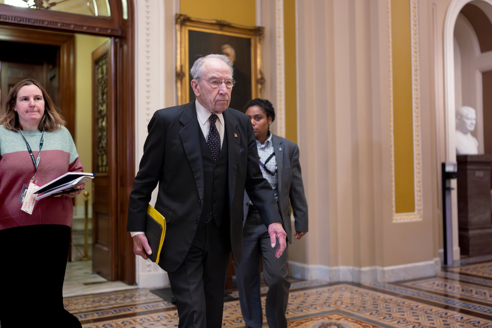 Sen. Chuck Grassley, R-Iowa, the president pro tempore, leaves the chamber to meet with Vice President JD Vance and fellow Republicans to discuss President Donald Trump's agenda, at the Capitol in Washington, Wednesday, Feb. 19, 2025. (AP Photo/J. Scott Applewhite)