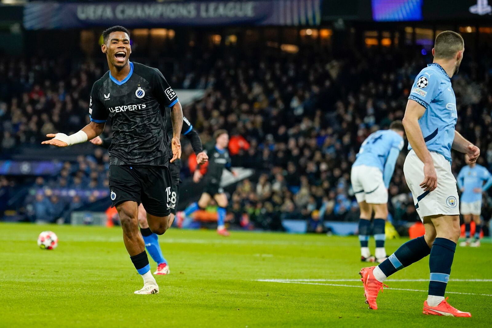 Brugge's Raphael Onyedika celebrates after scoring the opening goal during the Champions League opening phase soccer match between Manchester City and Club Brugge at the Etihad Stadium in Manchester, Wednesday, Jan. 29, 2025. (AP Photo/Dave Thompson)