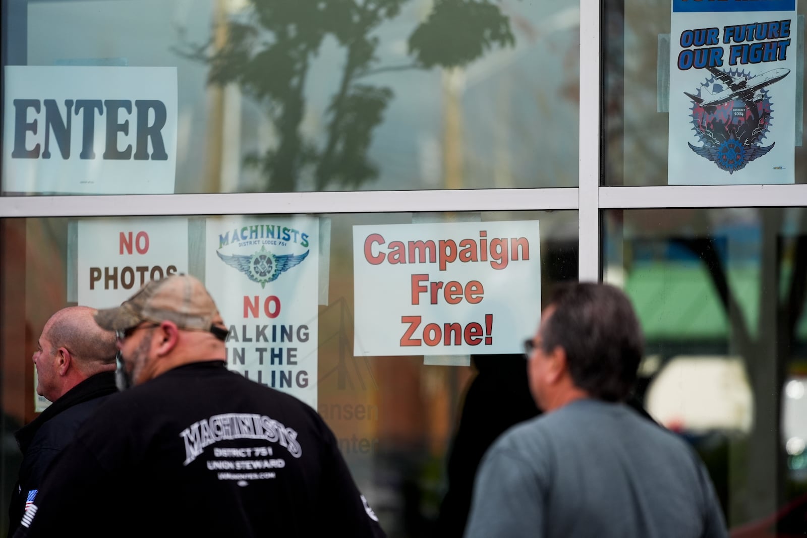 Boeing employees arrive to vote on a new contract offer from the company, Monday, Nov. 4, 2024, in Everett, Wash. (AP Photo/Lindsey Wasson)