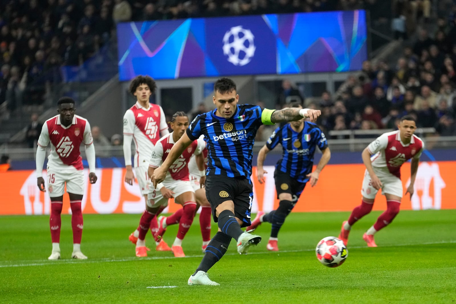 Inter Milan's Lautaro Martinez scores from penalty during a Champions League soccer match between Inter Milan and Monaco, at the San Siro stadium in Milan, Italy, Wednesday, Jan. 29, 2025. (AP Photo/Luca Bruno)