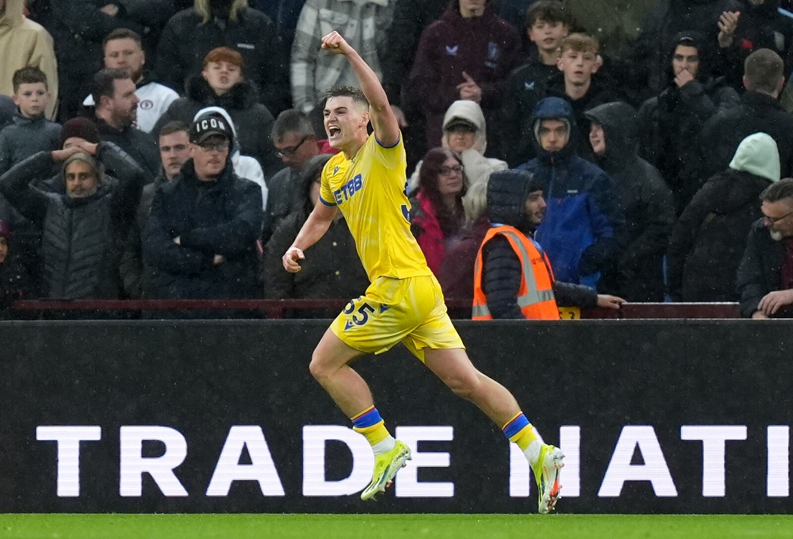 Crystal Palace's Justin Devenny celebrates scoring their side's second goal during the English Premier League soccer match between Aston Villa and Crystal Palace, at Villa Park, Birmingham, England, Saturday Nov. 23, 2024. (Jacob King/PA via AP)