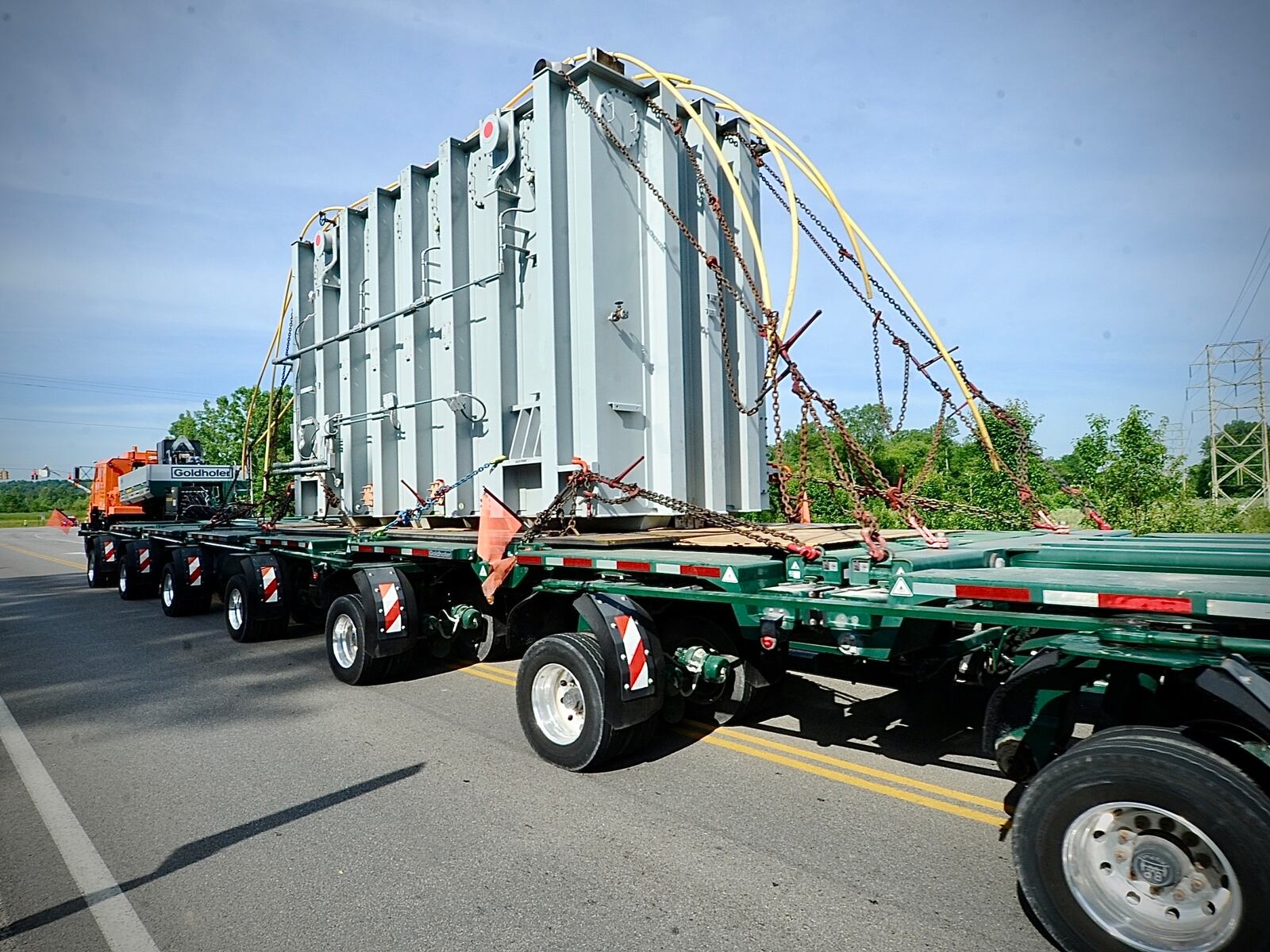 Piqua Steel Inc. moves a superload, an electronic transformer, down Treibein Road Tuesday, June 4, 2024, from the AES substation on Dayton Xenia Road to its new location at the new Honda plant in Fayette County. MARSHALL GORBY\STAFF