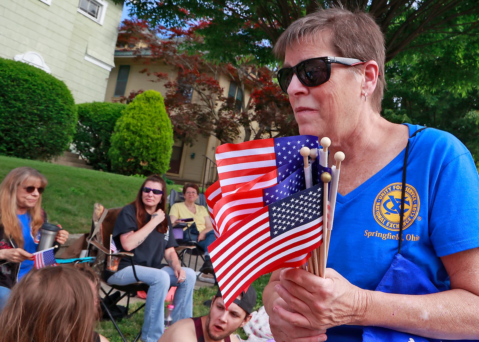 Thousands of people lined the parade route in their red, white and blue regalia to watch the 2023 Springfield Memorial Day Monday, May 29, 2023. The parade, which featured floats, fire trucks and bands, began with the throwing of the ceremonial wreath into Buck Creek and the somber sound of TAPS playing to honor those who haven given their lives in service to our country. BILL LACKEY/STAFF