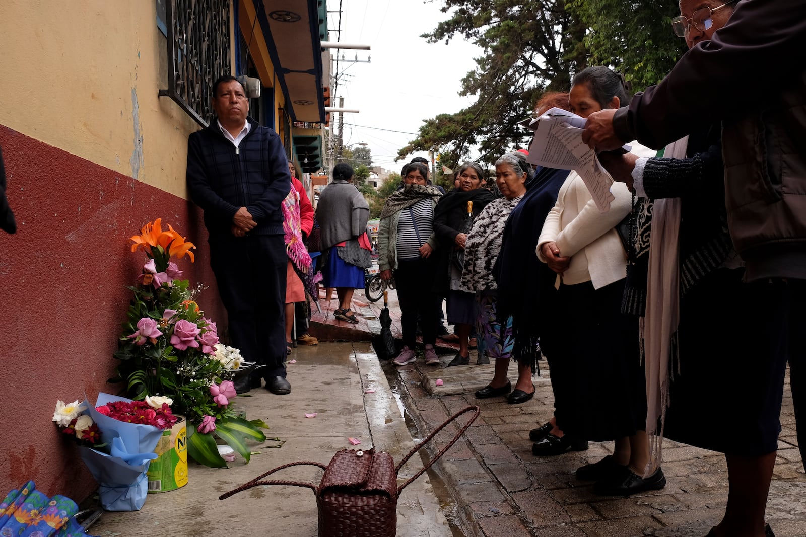 People gather around an altar where Catholic priest Marcelo Perez died in an armed attack after attending mass at a church in San Cristobal de las Casas, Chiapas state, Mexico, Sunday, Oct. 20, 2024. (AP Photo/Isabel Mateos)