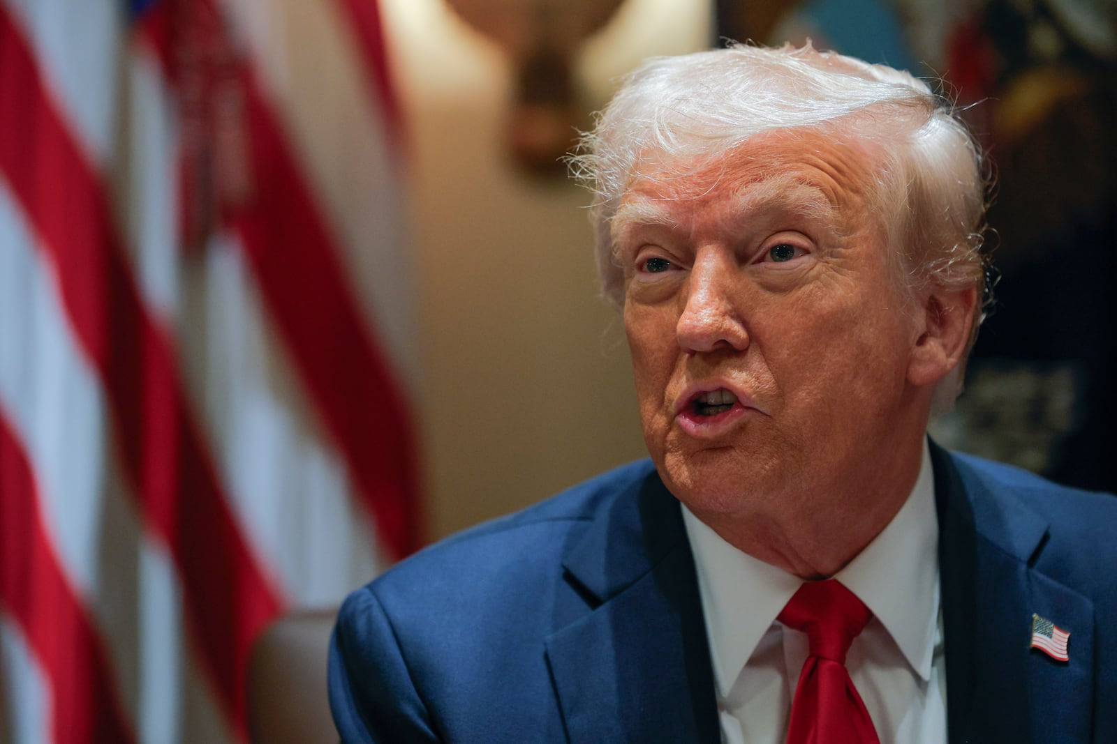 President Donald Trump speaks during a Cabinet meeting at the White House in Washington, Tuesday, Feb. 26, 2025. (Pool via AP)