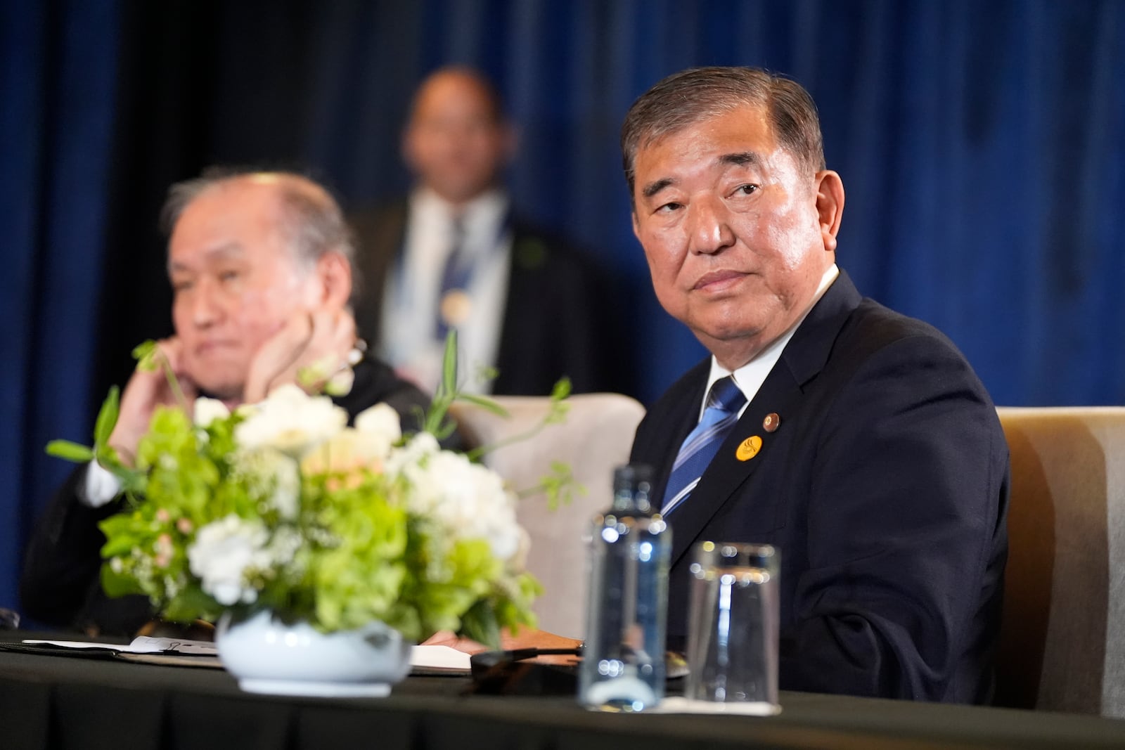 Prime Minister of Japan Shigeru Ishiba sits during a trilateral meeting with President Joe Biden and the President of South Korea Yoon Suk Yeol in Lima, Peru, Friday, Nov. 15, 2024. (AP Photo/Manuel Balce Ceneta)