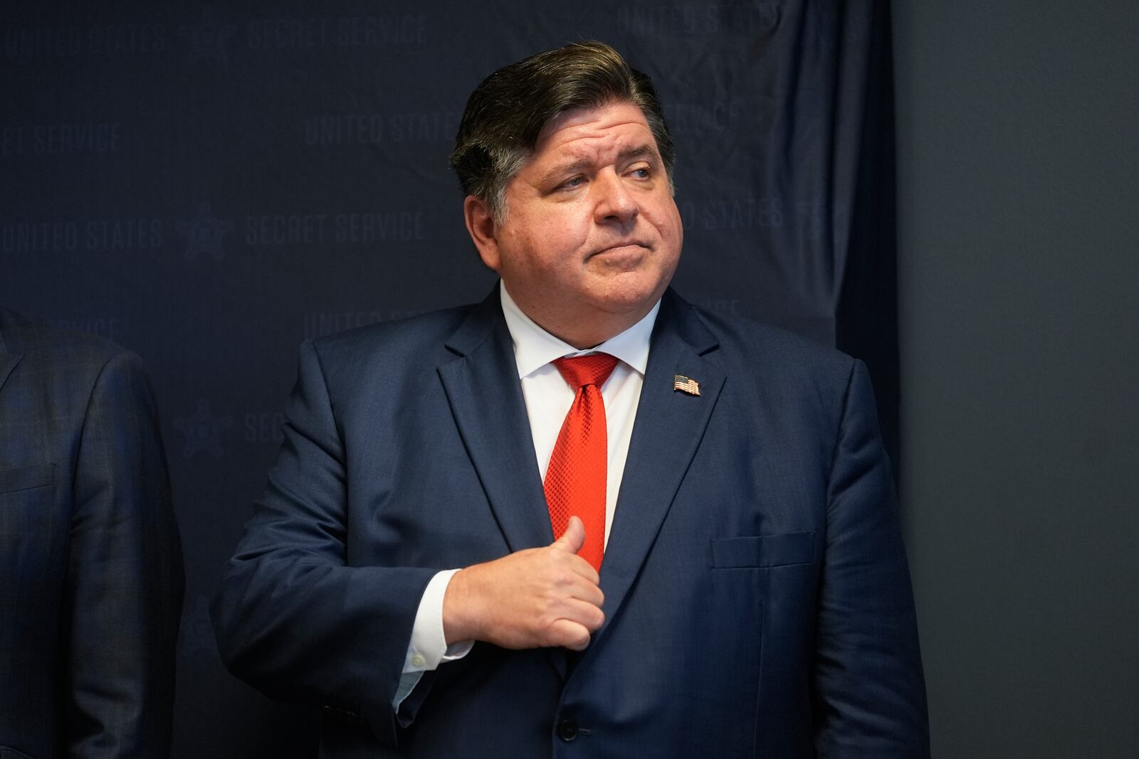 FILE - Illinois Gov. JB Pritzker waits to speak during a Democratic National Convention security briefing at the U.S. Secret Service's Chicago Field Office, in Chicago, July 25, 2024. (AP Photo/Erin Hooley, File)