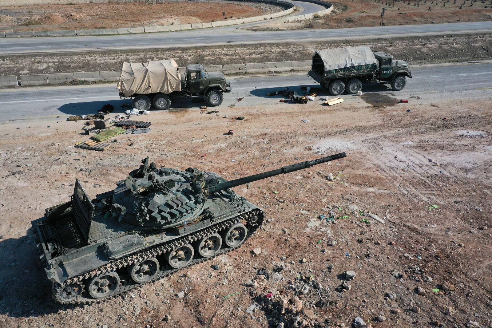 Abandoned Syrian army armoured vehicles sit on a road as opposition insurgents control the outskirts of Hama, Syria, Tuesday Dec. 3, 2024.(AP Photo/Ghaith Alsayed)