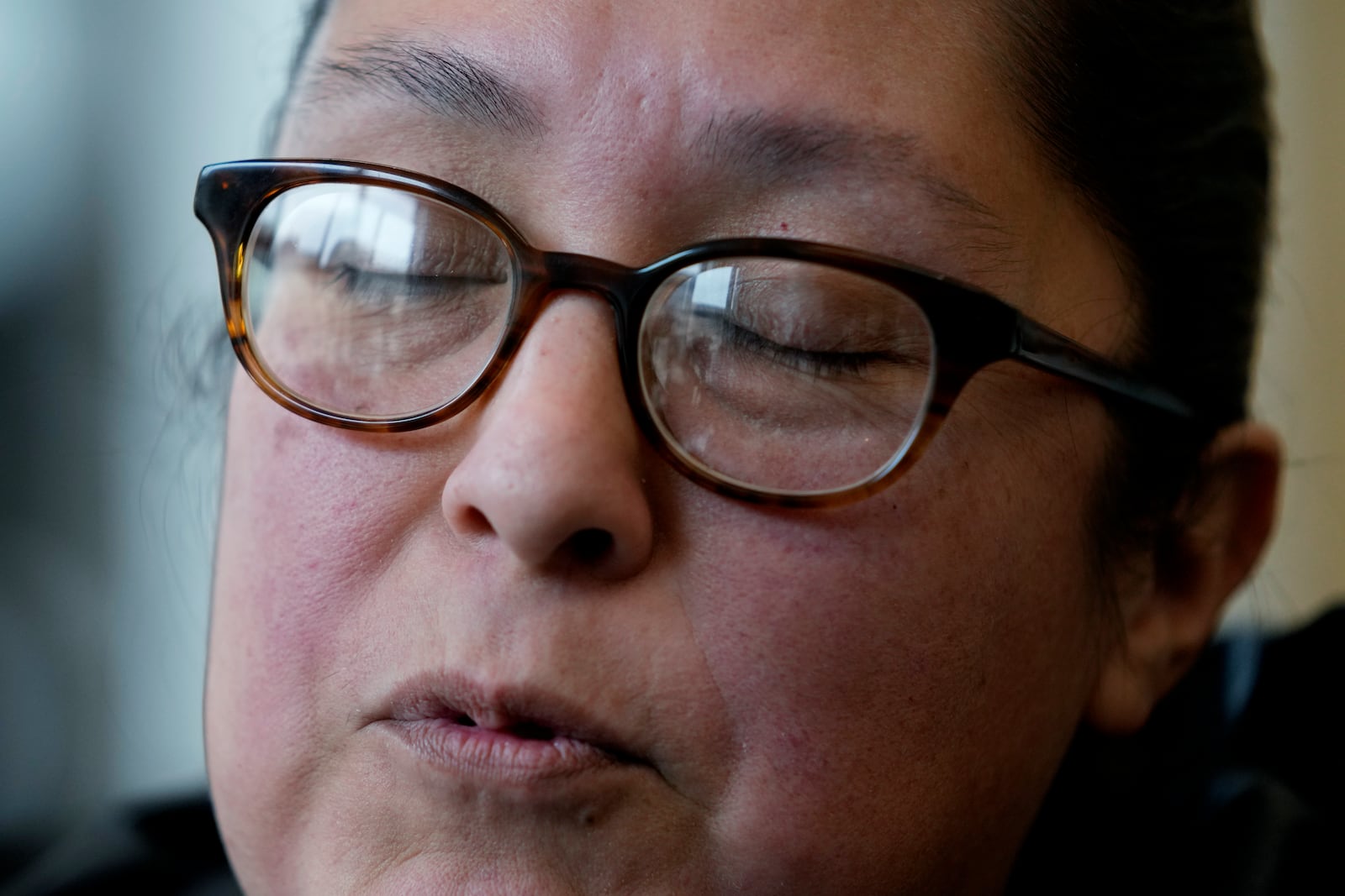 Highland Park parade survivor Ashbey Beasley closes her eyes as she talks to media after Robert E. Crimo III pleaded guilty to the Highland Park parade shooting at the Lake County Courthouse in Waukegan, Ill., Monday, March 3, 2025. (AP Photo/Nam Y. Huh, Pool)