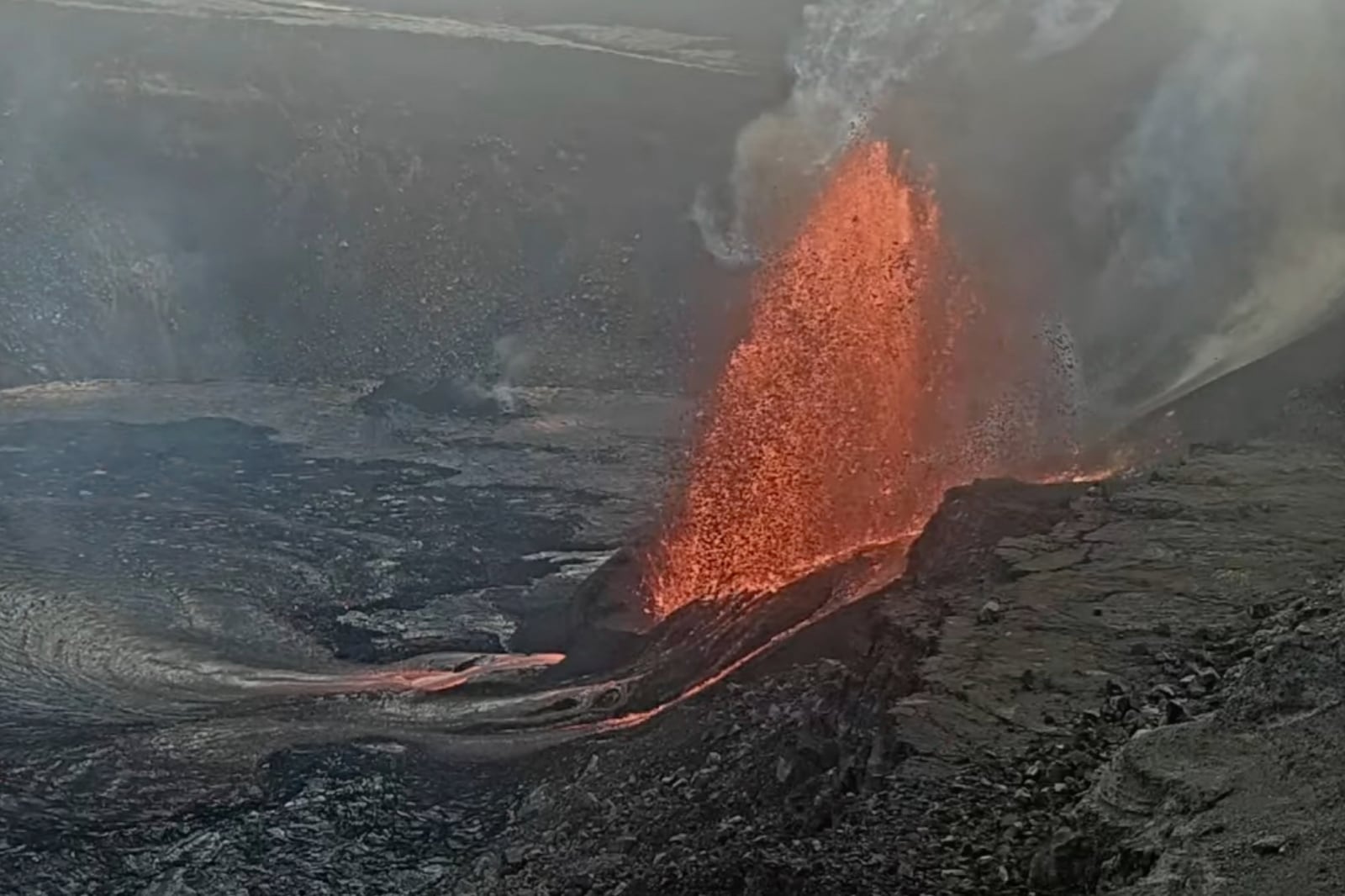 This handout photo from the U.S. Geological Survey shows lava erupting from Haleumaumau Crater at the summit of Kilauea volcano inside Hawaii Volcanoes National Park, Hawaii., on Tuesday, Feb. 11, 2025. (U.S. Geological Survey via AP)