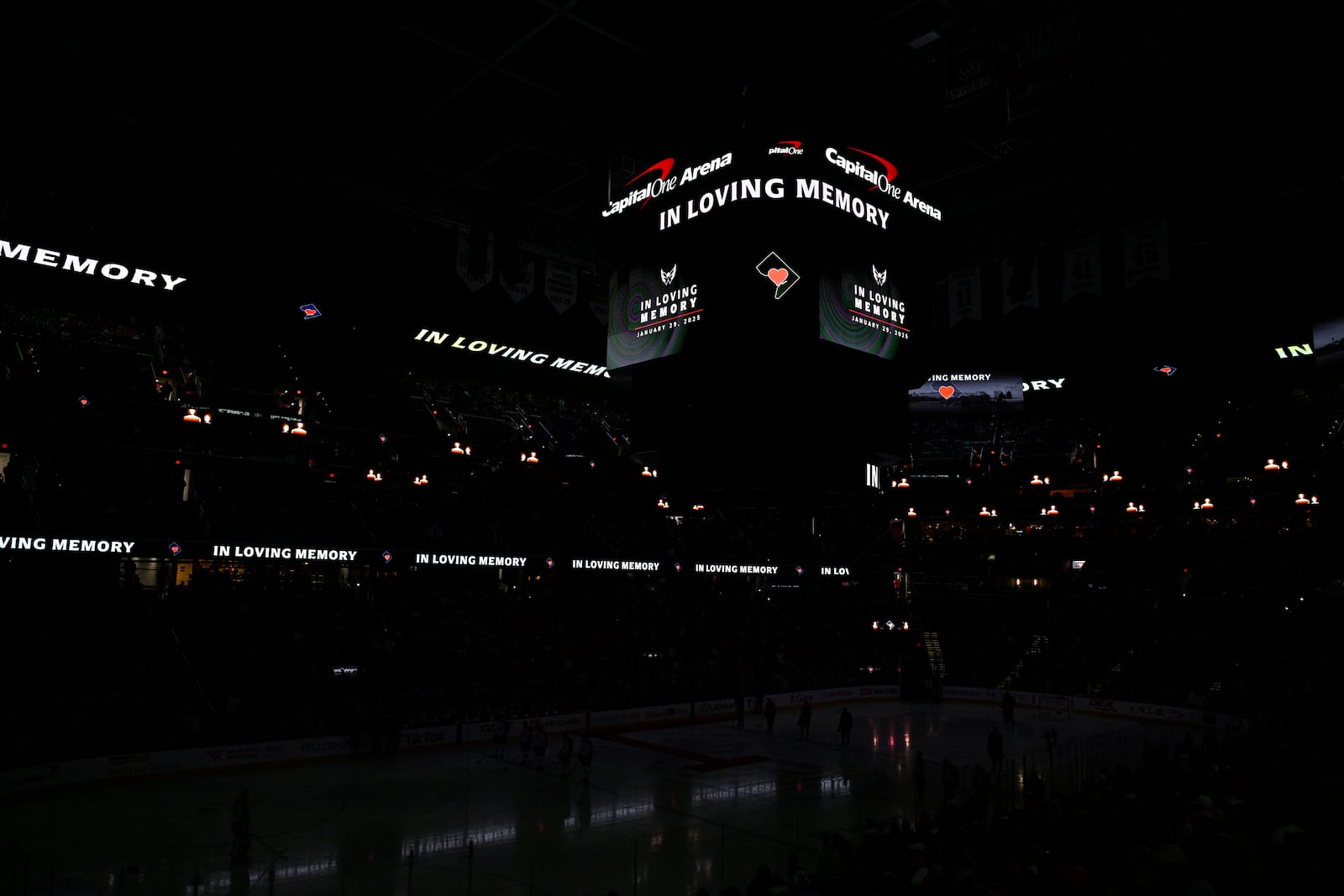 The scoreboard displays a tribute to the victims of the Washington-area plane crash before an NHL hockey game between the Washington Capitals and the Winnipeg Jets, Saturday, Feb. 1, 2025, in Washington. (AP Photo/Nick Wass)