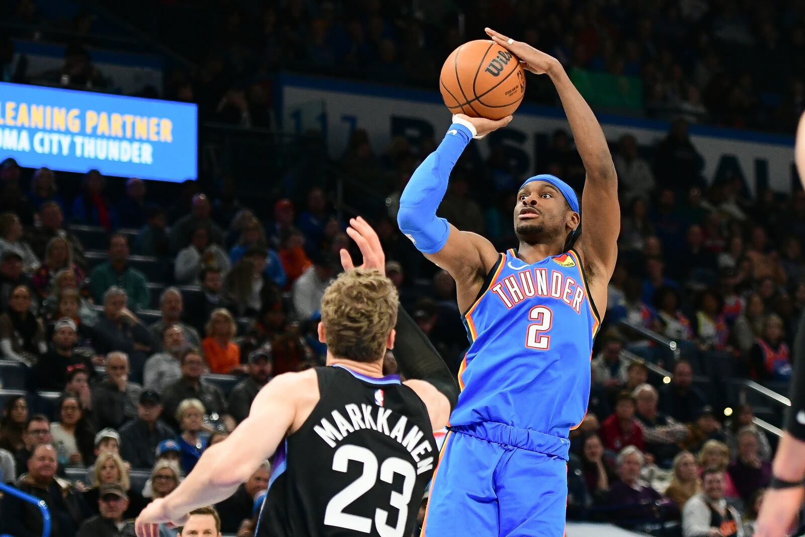 Oklahoma City Thunder guard Shai Gilgeous-Alexander (2) shoots over Utah Jazz forward Lauri Markkanen (23) during the first half of an NBA basketball game, Wednesday, Jan. 22, 2025, in Oklahoma City. (AP Photo/Kyle Phillips)