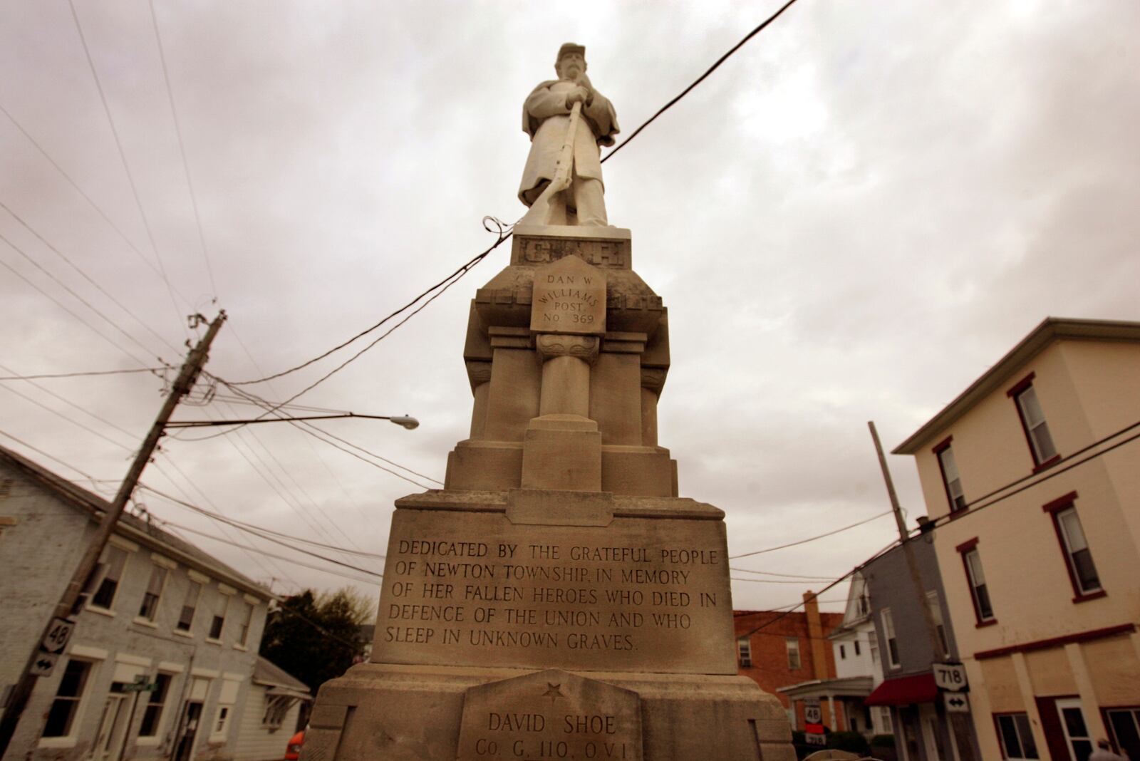 A view of the Pleasant Hill Civil War Soldier monument on Main Street in Pleasant Hill. The village was to move the solider out of the middle of Ohio 48 and 718 but now there are those who are changing their minds. The state already gave the village lots of new money for street upgrades with agreement Soldier would be moved to a near park nearby. Photo by Jim Witmer