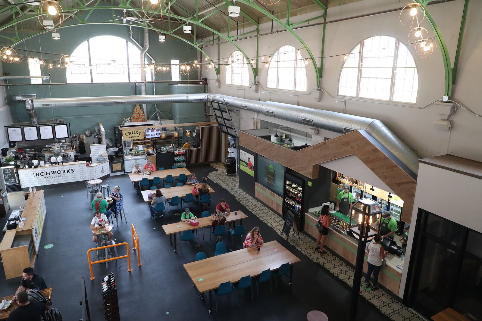 All the businesses are now open in the COhatch Market and the building, which once housed the Myers Market, is again filled with people and business. BILL LACKEY/STAFF