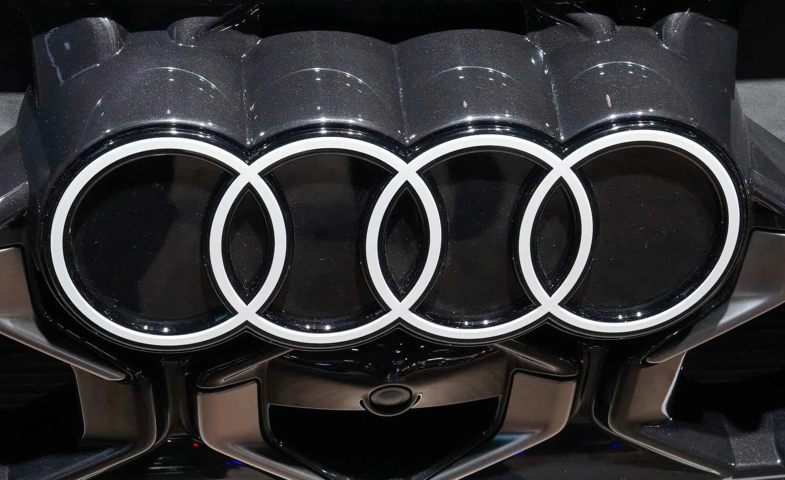 The logo of Audi is photographed at the Paris Auto Show, in Paris, Monday, Oct. 14, 2024. (AP Photo/Michel Euler)