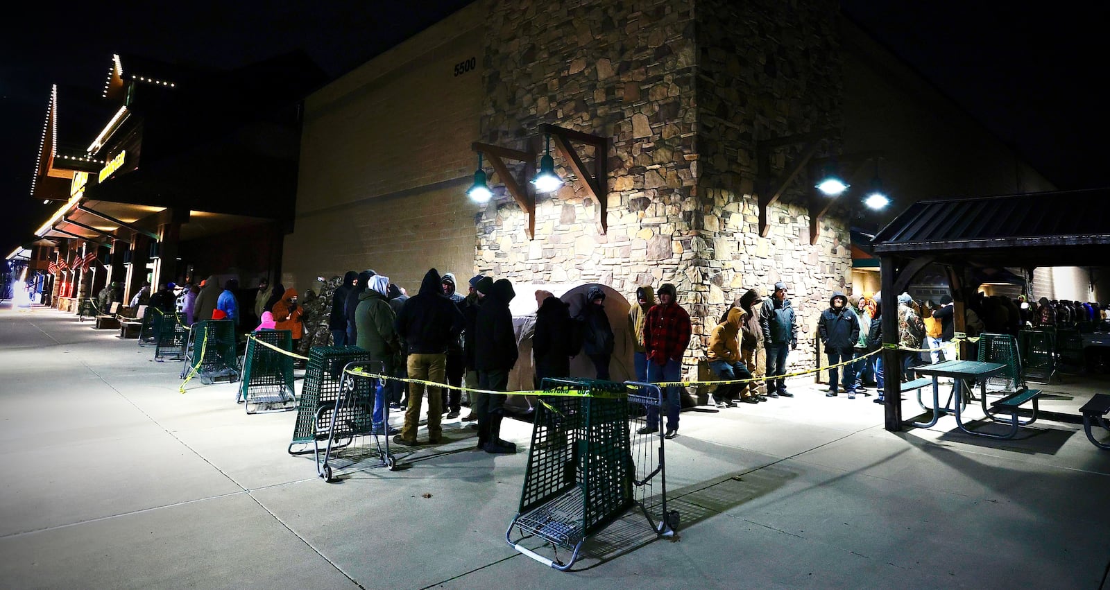 Black Friday shoppers lined up around Cabela’s in Centerville to receive free gift cards and to shop for good deals on Nov. 29, 2024. MARSHALL GORBY / STAFF