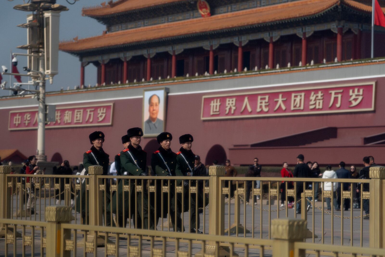 Chinese paramilitary policemen march past late Chinese leader Mao Zedong's portrait on Tiananmen Gate near the Great Hall of the People ahead of the National People's Congress in Beijing, on Feb. 28, 2025. (AP Photo/Ng Han Guan)