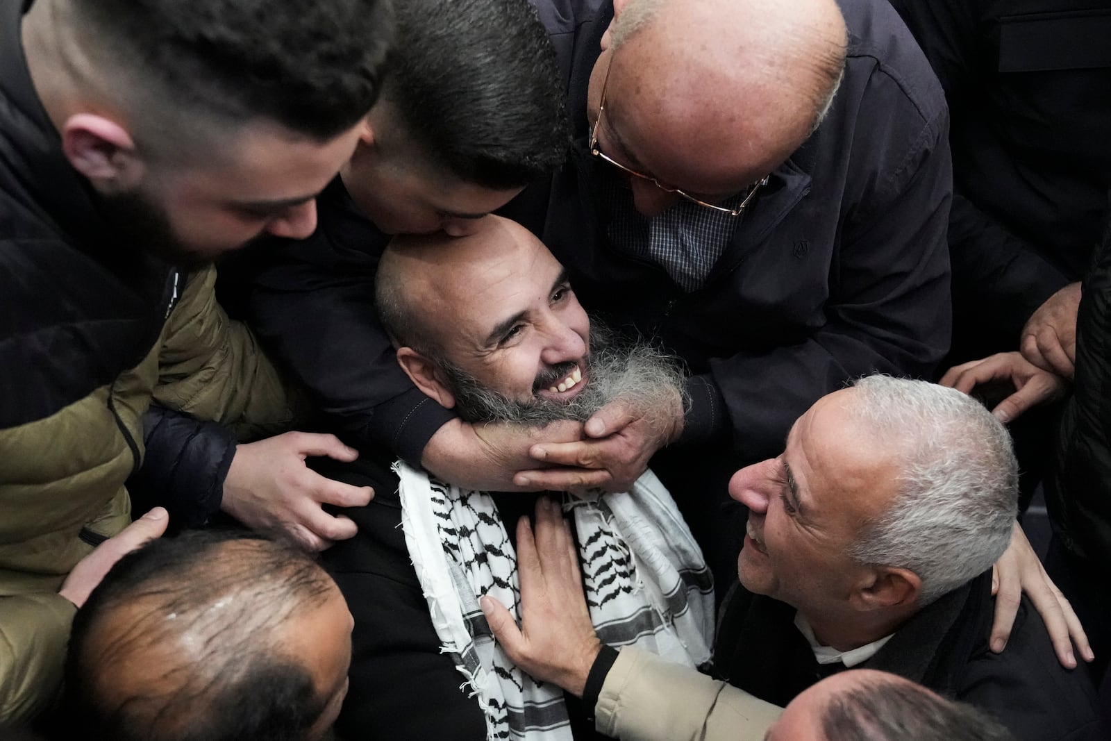 Palestinian prisoners are greeted after being released from Israeli prison following a ceasefire agreement between Israel and Hamas, in the West Bank city of Ramallah, Saturday, Feb. 15, 2025. (AP Photo/Mahmoud Illean)