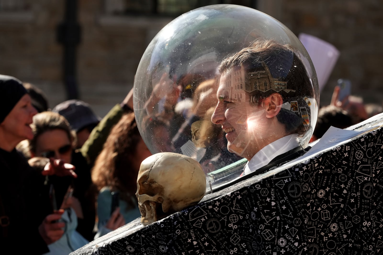 A competitor is seen in a costume during a traditional pancake race by livery companies at the Guildhall in London, Tuesday, March 4, 2025.(AP Photo/Frank Augstein)