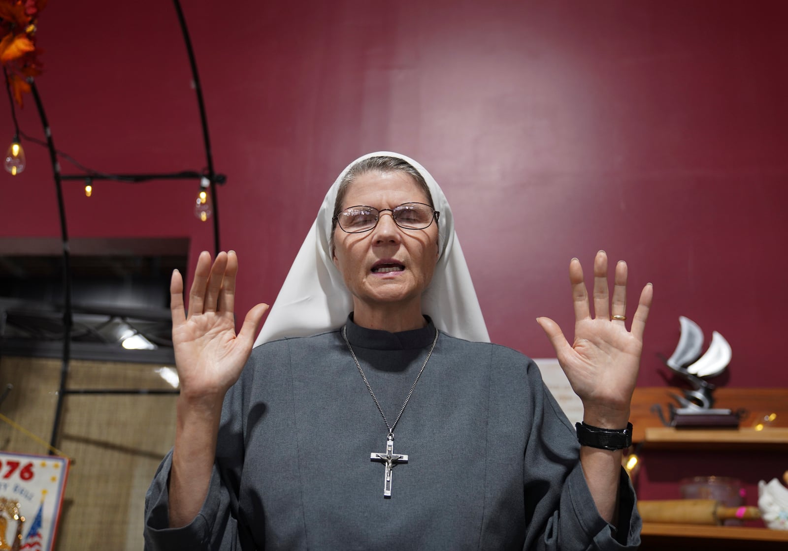 Sister Joan Paule Portenlanger of the Franciscan Sisters, T.O.R. of Penance of the Sorrowful Mother, worship at Urban Thrift and Opportunity Center, in Steubenville, Ohio, Thursday, Nov. 7, 2024. (AP Photo/Jessie Wardarski)