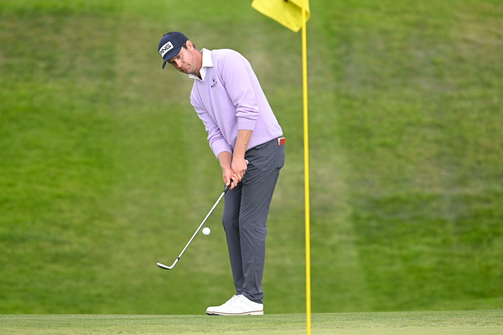 Harris English hits his second shot on the 10th hole on the South Course at Torrey Pines during the final round of the Farmers Insurance Open golf tournament Saturday, Jan. 25, 2025, in San Diego. (AP Photo/Denis Poroy)