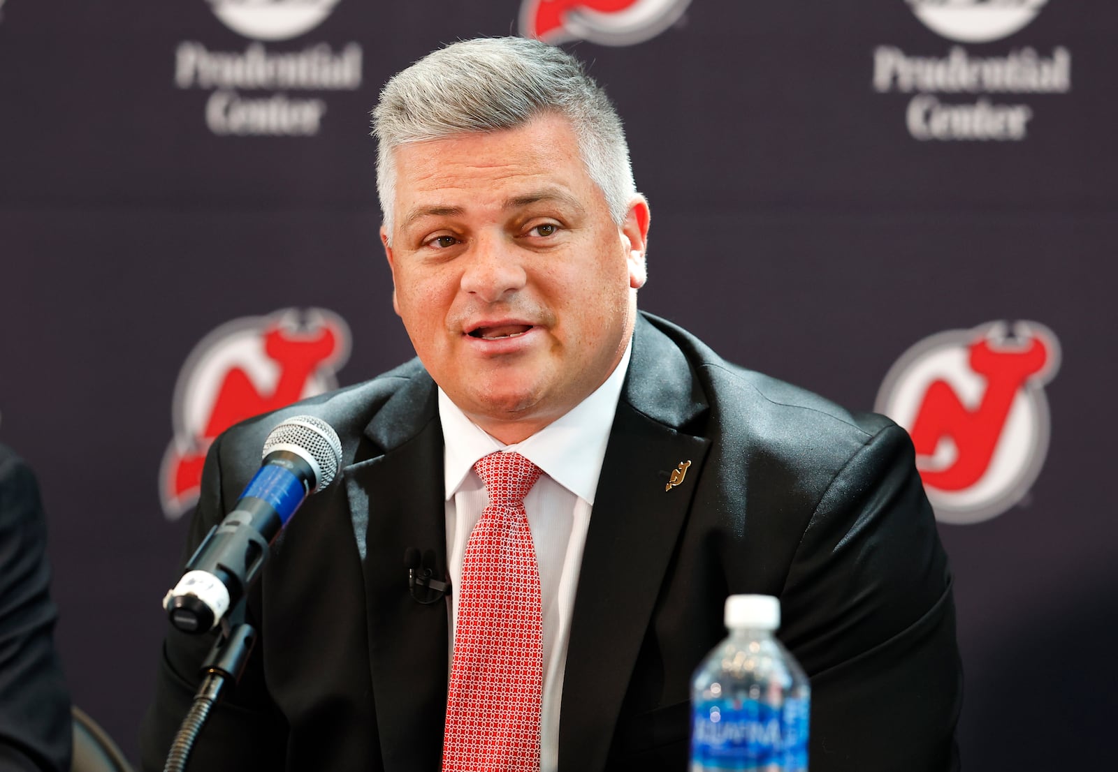 FILE - New Jersey Devils NHL hockey team new head coach Sheldon Keefe answers questions from reporters during press conference Tuesday, May 28, 2024, in Newark, N.J. (AP Photo/Noah K. Murray, File)