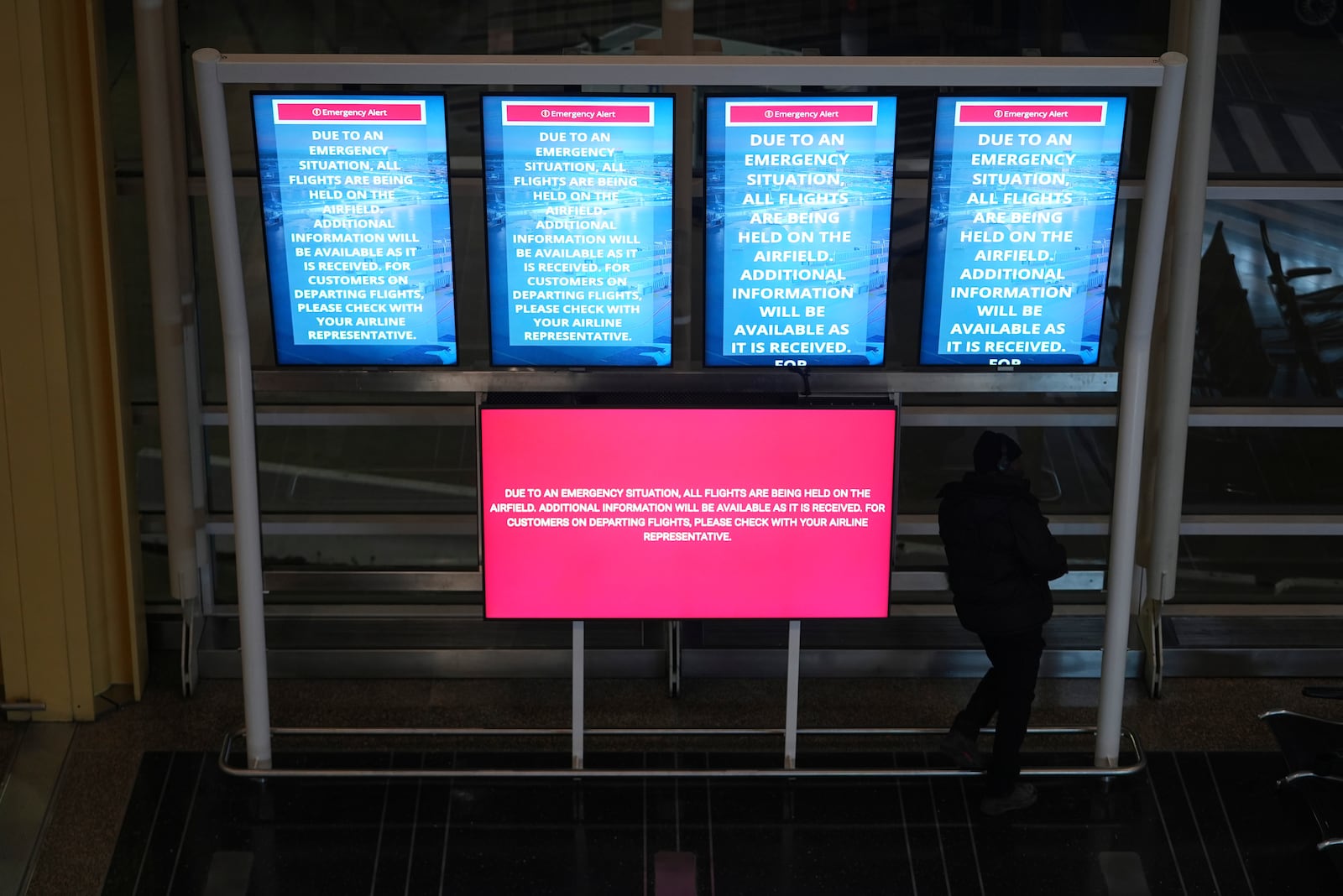 A information board displays a message at Ronald Reagan Washington National Airport, Wednesday, Jan. 29, 2025, in Arlington, Va. (AP Photo/Julio Cortez)