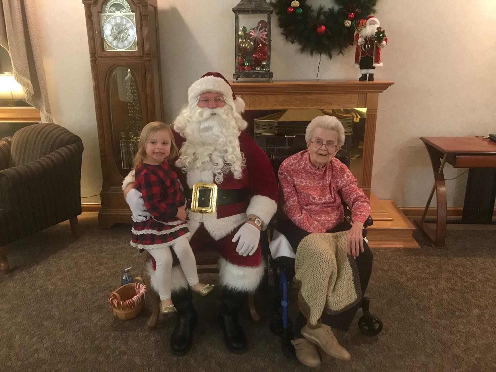 Vera Gudorf with Santa Claus and great granddaughter Piper Sutton.