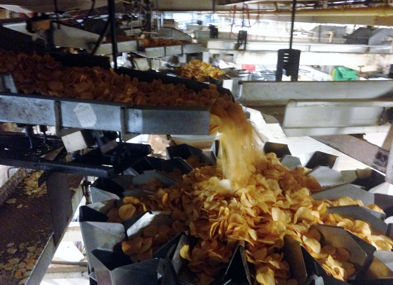 Chips being bagged at Mike-Sells Potato Chips Company on Leo Street in Dayton. (Photo by Amelia Robinson, Staff)