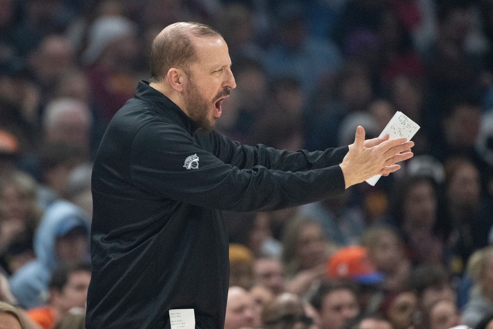 New York Kincks head coach Tom Thibodeau calls a play against the Cleveland Cavaliers during the first half of an NBA basketball game in Cleveland, Friday, Feb. 21, 2025. (AP Photo/Phil Long)