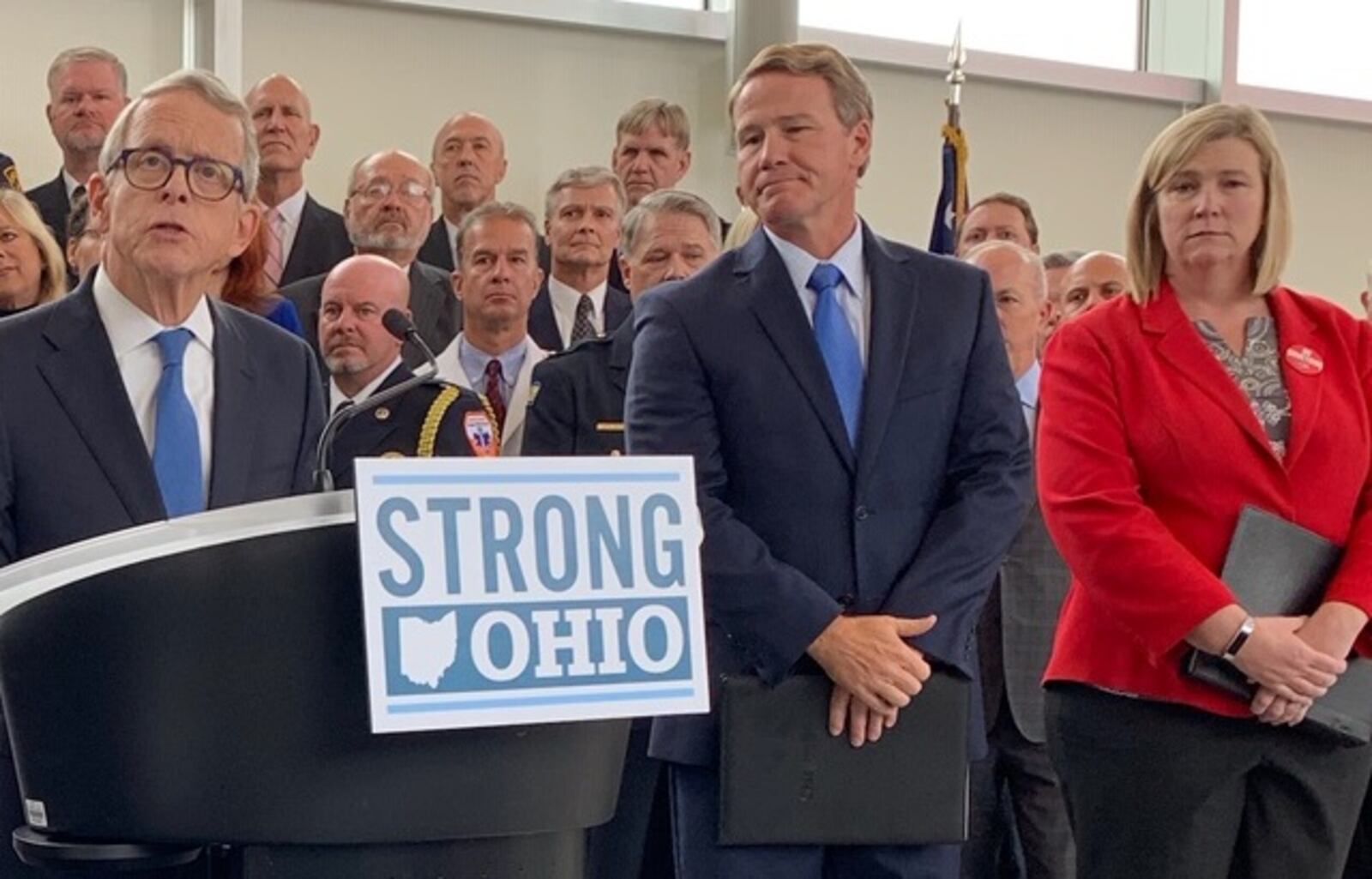 Gov. Mike DeWine announces his Strong Ohio gun bill plan Monday, Oct. 7 in Columbus. Lt. Gov. Jon Husted and Dayton Mayor Nan Whaley are to his right. Photo by Laura Bischoff