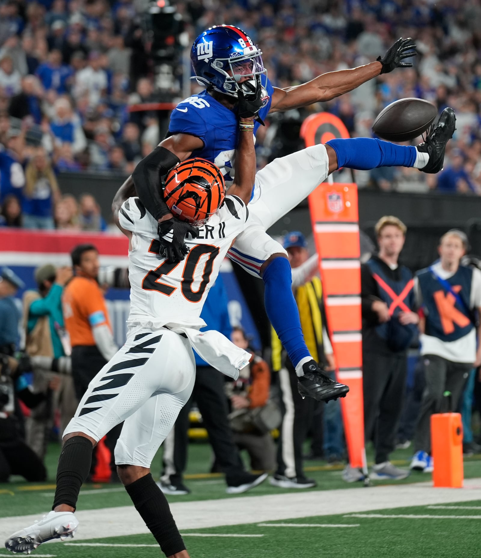 Cincinnati Bengals cornerback DJ Turner II (20) breaks up a pass intended for New York Giants wide receiver Darius Slayton (86) during the second half of an NFL football game, Sunday, Oct. 13, 2024, in East Rutherford, N.J. (AP Photo/Seth Wenig)