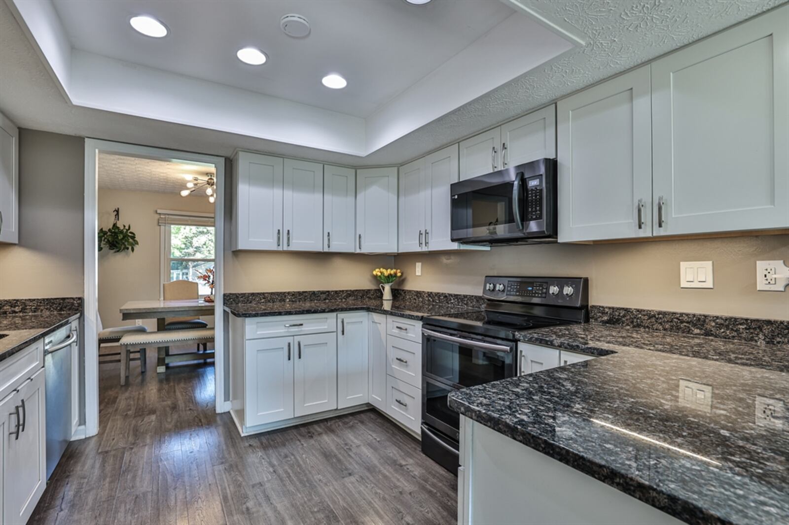 The kitchen comes equipped with a stainless-steel range, microwave, dishwasher and refrigerator.