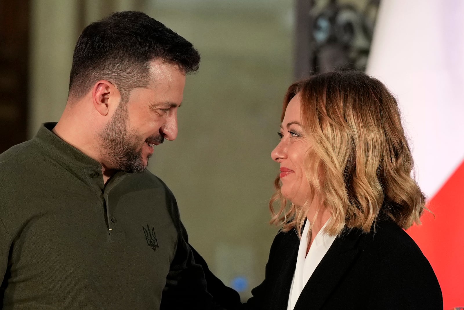 Italian Premier Giorgia Meloni, right, smiles with Ukrainian President Volodymyr Zelenskyy after the press conference, at Villa Pamphilj, in Rome, Thursday, Oct. 10, 2024. (AP Photo/Andrew Medichini)