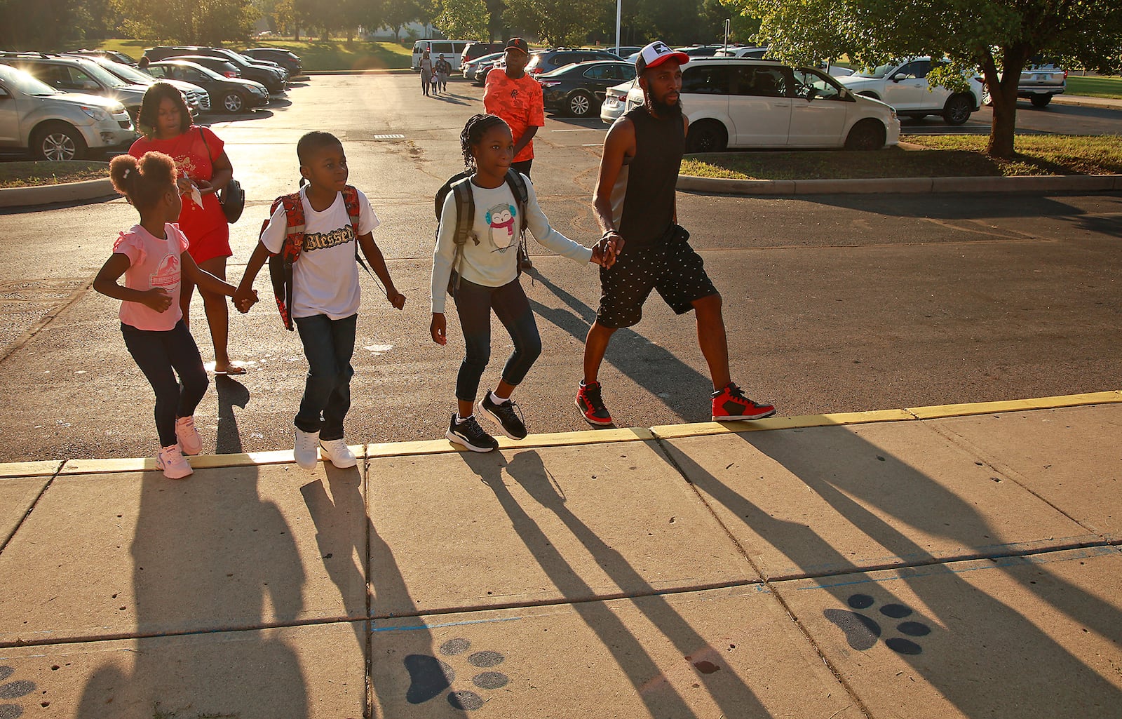 Students arrive with their families for the first day of school at Fulton Elementary Wednesday, August 14, 2024. BILL LACKEY/STAFF