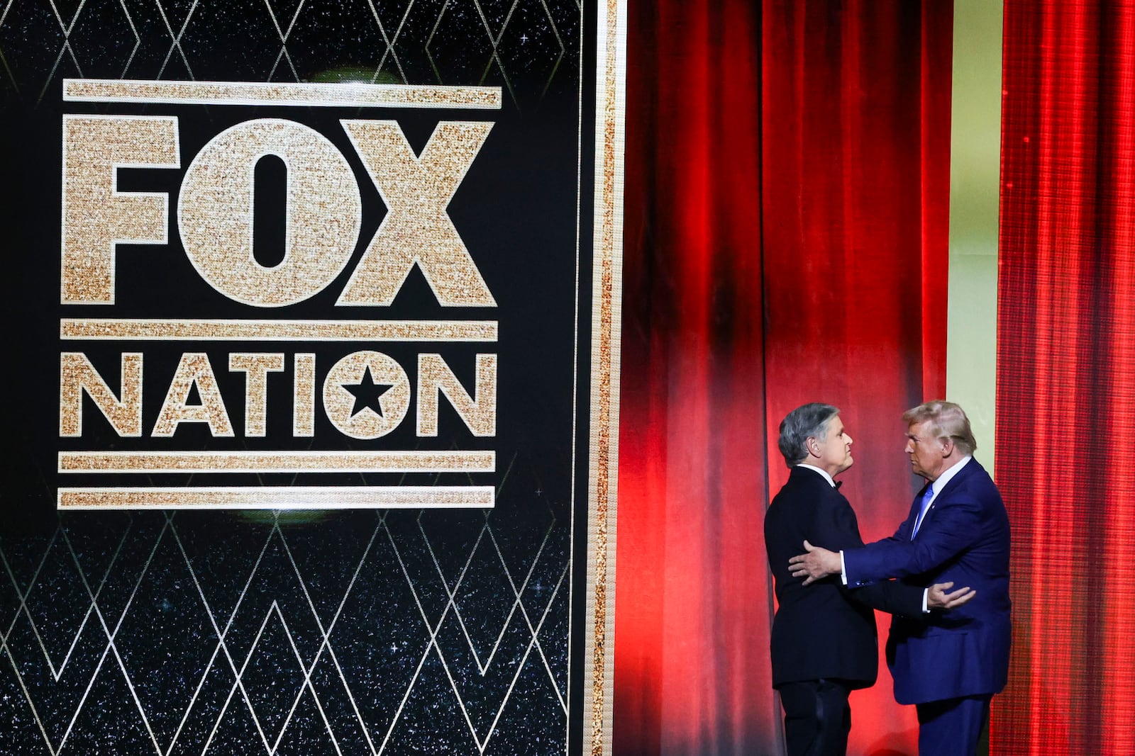 FILE - Sean Hannity and President-elect Donald Trump greet following the FOX Nation Patriot Awards, in Greenvale, N.Y., Dec. 5, 2024. (AP Photo/Heather Khalifa, File)