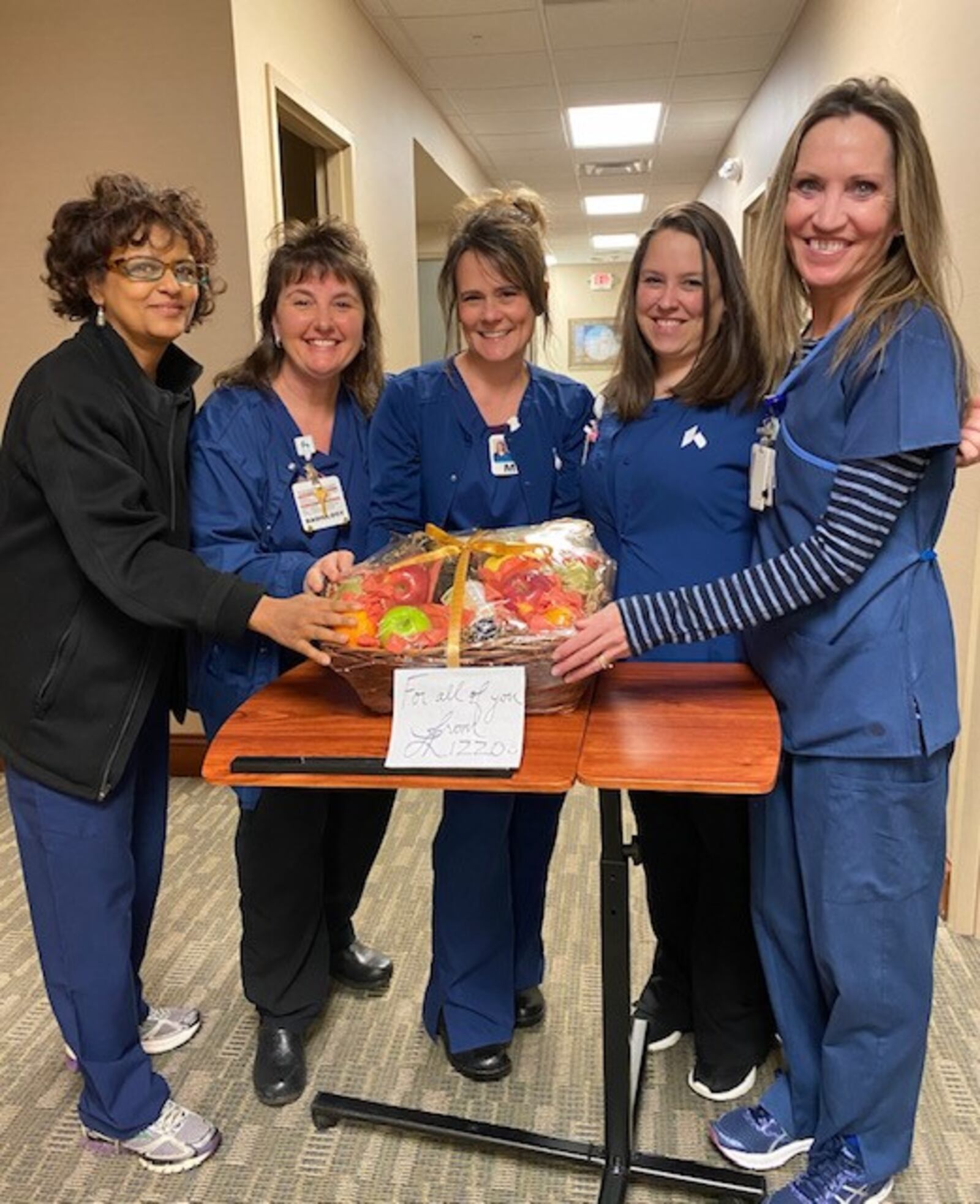 Wayne High School graduate Lauren Alford, the daughter of  Michael and Virginia Mack, deejays for singer Lizzo under the stage name Sophia Eris.  Lizzo  created  video messages of support  for Eris' mother, a unltrasound tech for Kettering Health Network, and other healthcare workers around the nation battling coronavirus.  Pictured: Virginia Mack (far right) and some of her co-workers from Sugarcreek Health Center with a basket from Lizzo.