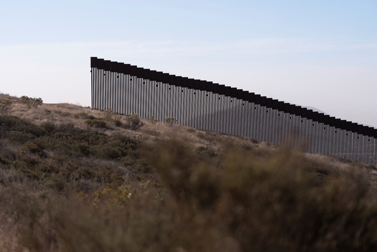 A gap in one of two border walls separating Mexico from the United States is seen Thursday, Jan. 23, 2025, in San Diego. (AP Photo/Gregory Bull)