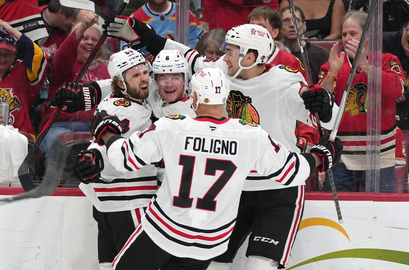 Chicago Blackhawks left wing Landon Slaggert, left, celebrates after scoring a goal against Florida Panthers goaltender Sergei Bobrovsky during the first period of an NHL hockey game, Saturday, Feb. 1, 2025, in Sunrise, Fla. (AP Photo/Lynne Sladky)