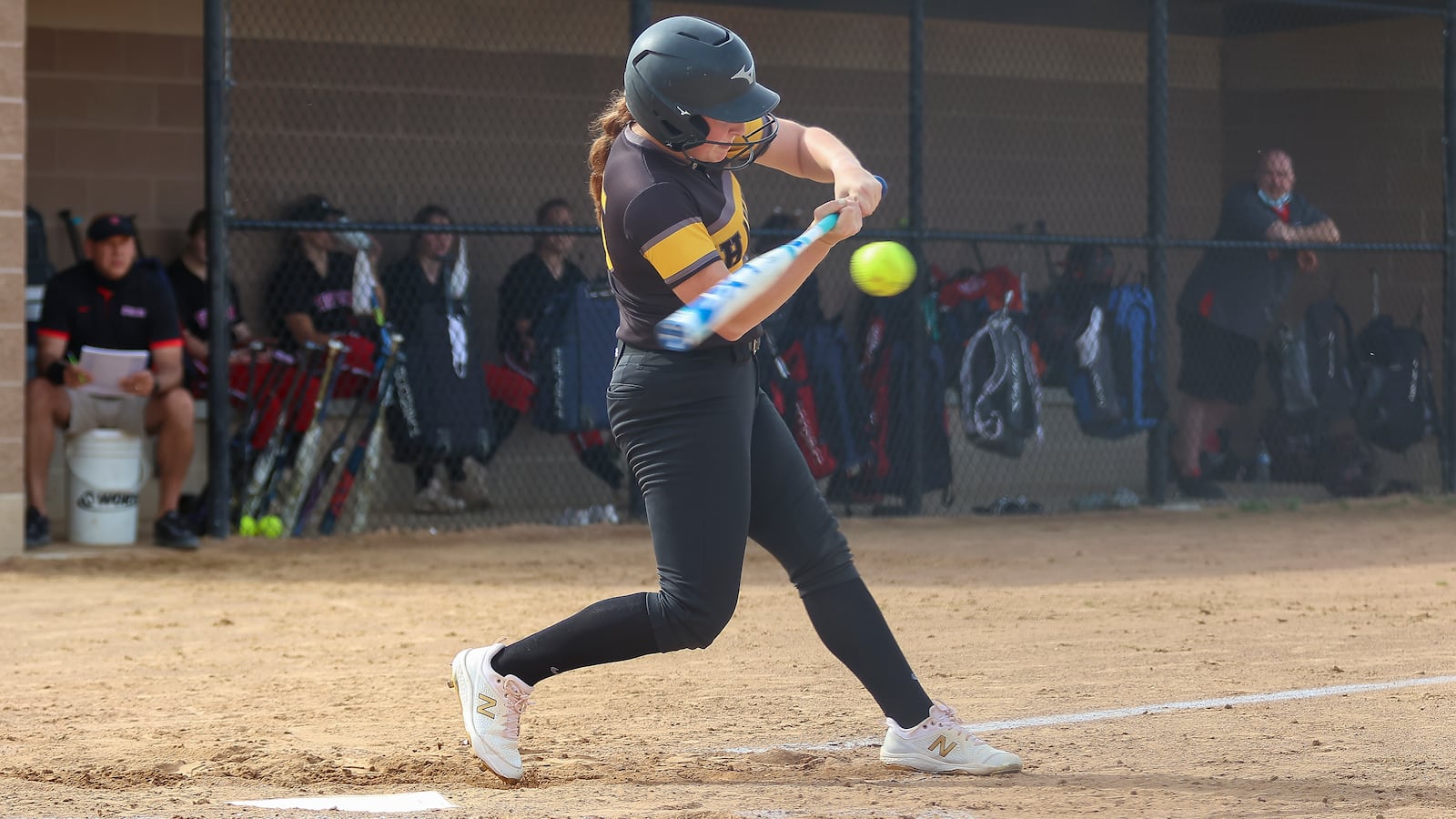 Shawnee High School senior Alise Moneypenny swings the bat during their game against Tippecanoe in a D-II district semifinal game on Tuesday at Northwestern High School. The Braves won 5-4 in 10 innings. CONTRIBUTED PHOTO BY MICHAEL COOPER