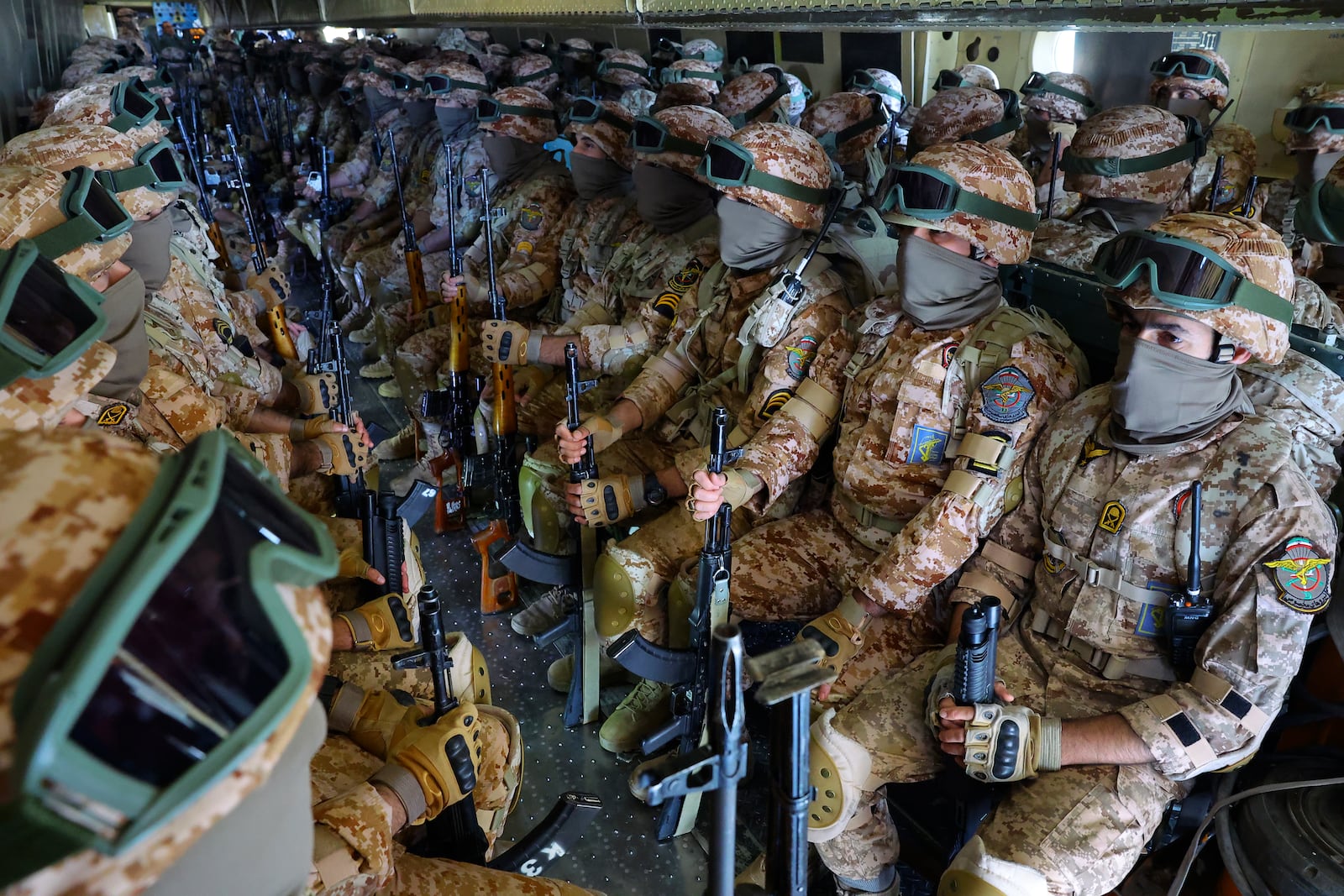 FILE - In this photo released by the Tasnim News Agency, the Iranian Revolutionary Guard troops travel in a plane from Rasht in northern Iran, to Kermanshah in western Iran, during a drill on Jan. 5, 2025. (Hossein Zohrevand/Tasnim News Agency via AP, File)