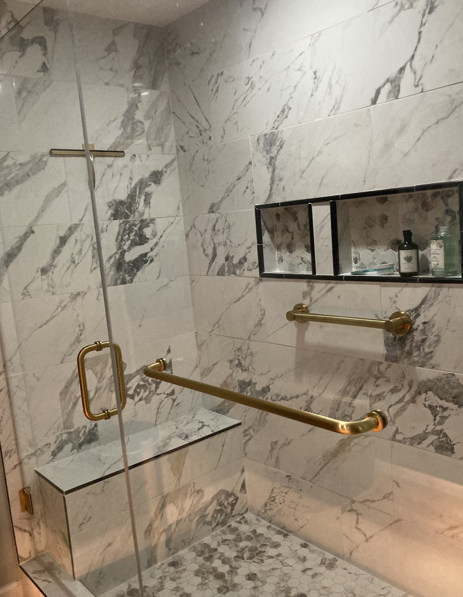 Debbie Shaw's new walk-in shower is equipped with jets, a custom in-wall shelf for toiletries, and a showerhead that changes colors depending on the temperature of the water. Contributed by Sarah Franks Fries