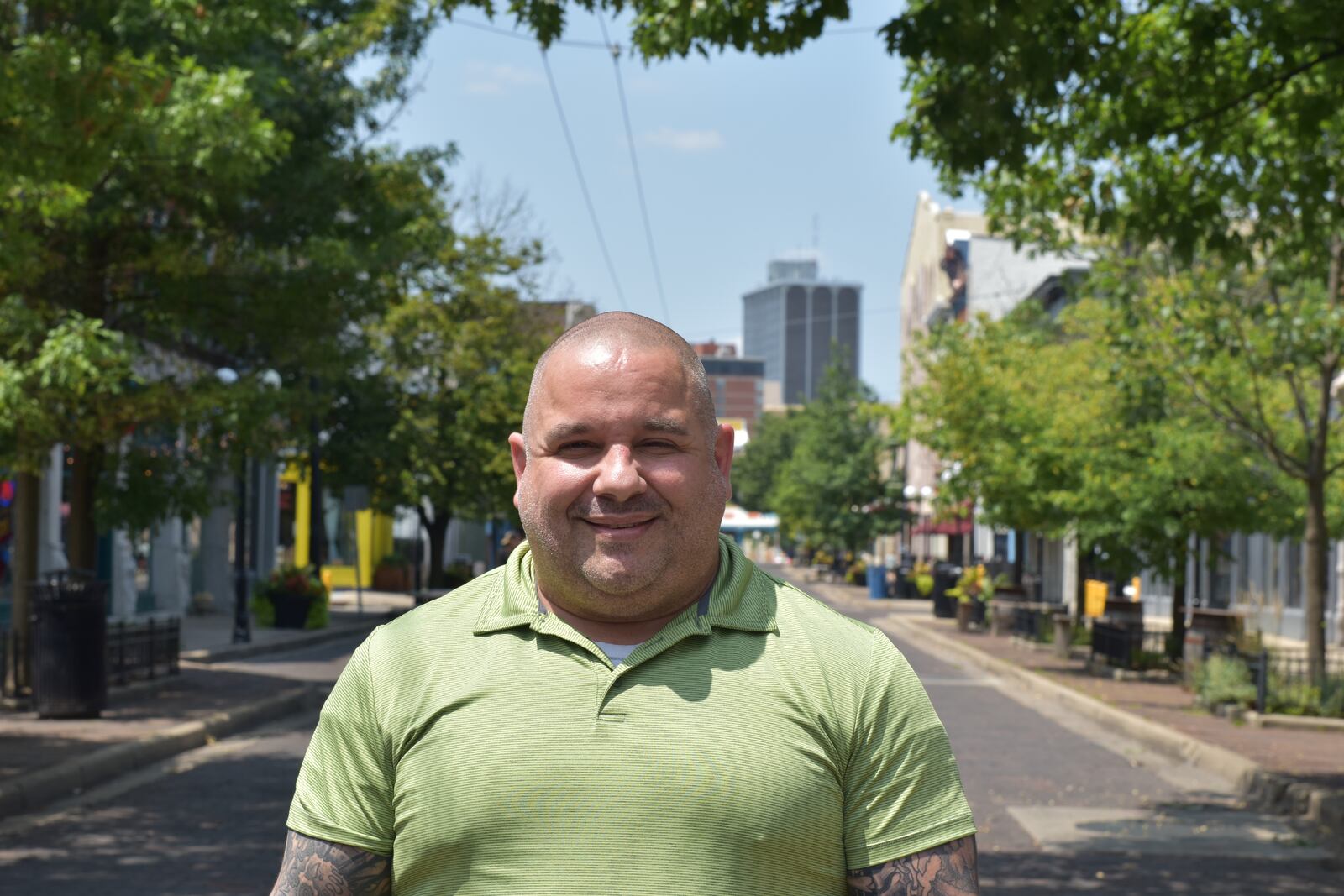 Jeremy Ganger was working as a bouncer at Ned Peppers during the mass shooting in the Oregon District on Aug. 4, 2019. Ganger says the community must not forget the lives that were lost and people who were impacted by that terrible tragedy. CORNELIUS FROLIK / STAFF