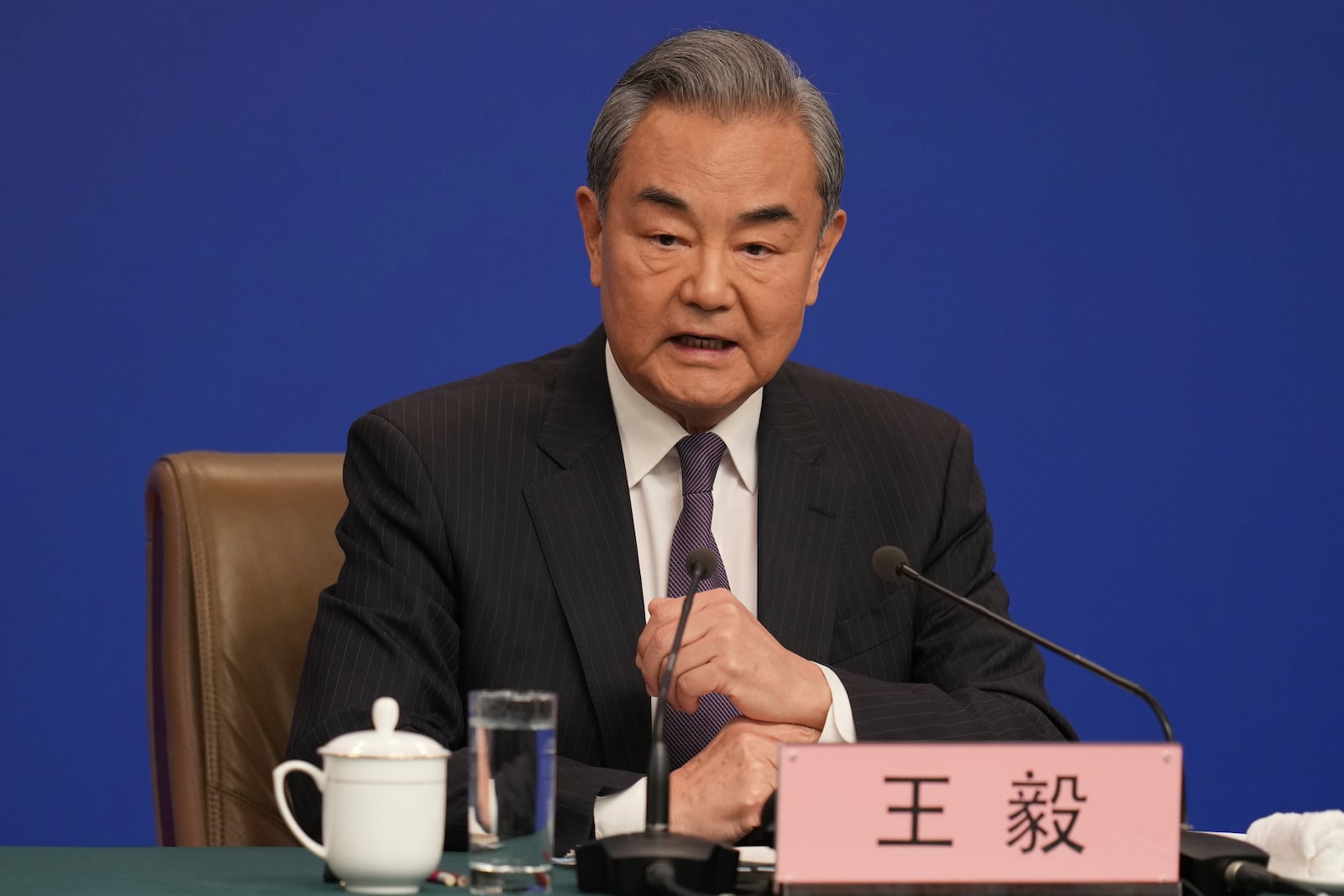 Chinese Foreign Minister Wang Yi speaks during a press conference on the sideline of the National People's Congress in Beijing, Friday, March 7, 2025. (AP Photo/Ng Han Guan)